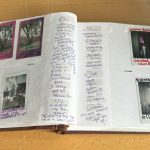 An open photo album features pictures including a lava lamp and Christmas tree. Next to the photos are hand-written descriptions where the object describes its lack of use.